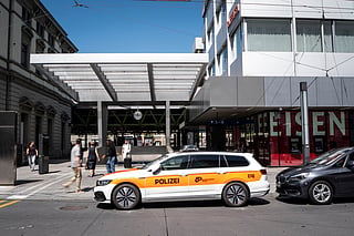 A police vehicle is parked in front of Winterthur train station following a stabbing attack in Winterthur, Switzerland, Thursday, May 28, 2026. (Claudio Thoma/Keystone via AP)