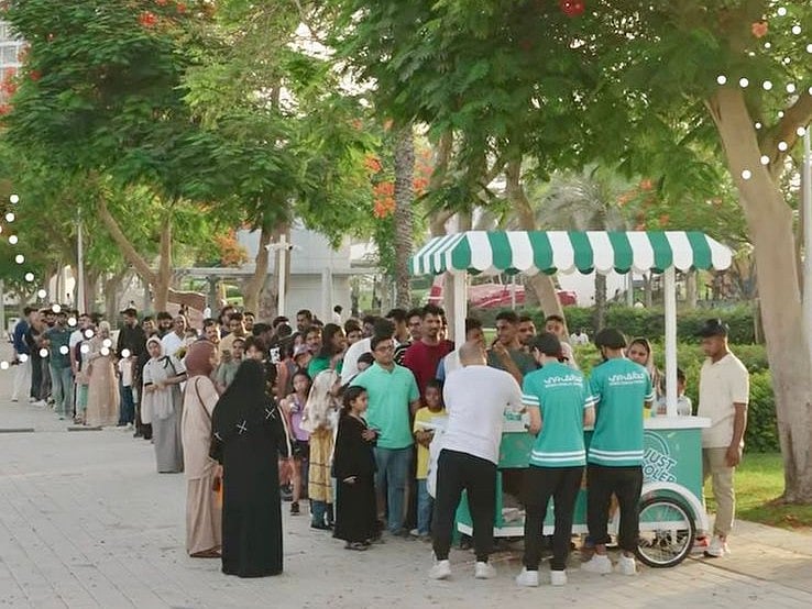 A screengrab of the video shows long queues of young and old park visitors waiting to receive their Eid treat. 