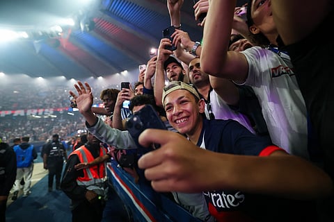 PSG supporters celebrate at Parc des Princes stadium, in Paris on May 31, 2026, during a special event organised to celebrate with supporters their victory over Arsenal FC in the UEFA Champions League final.
