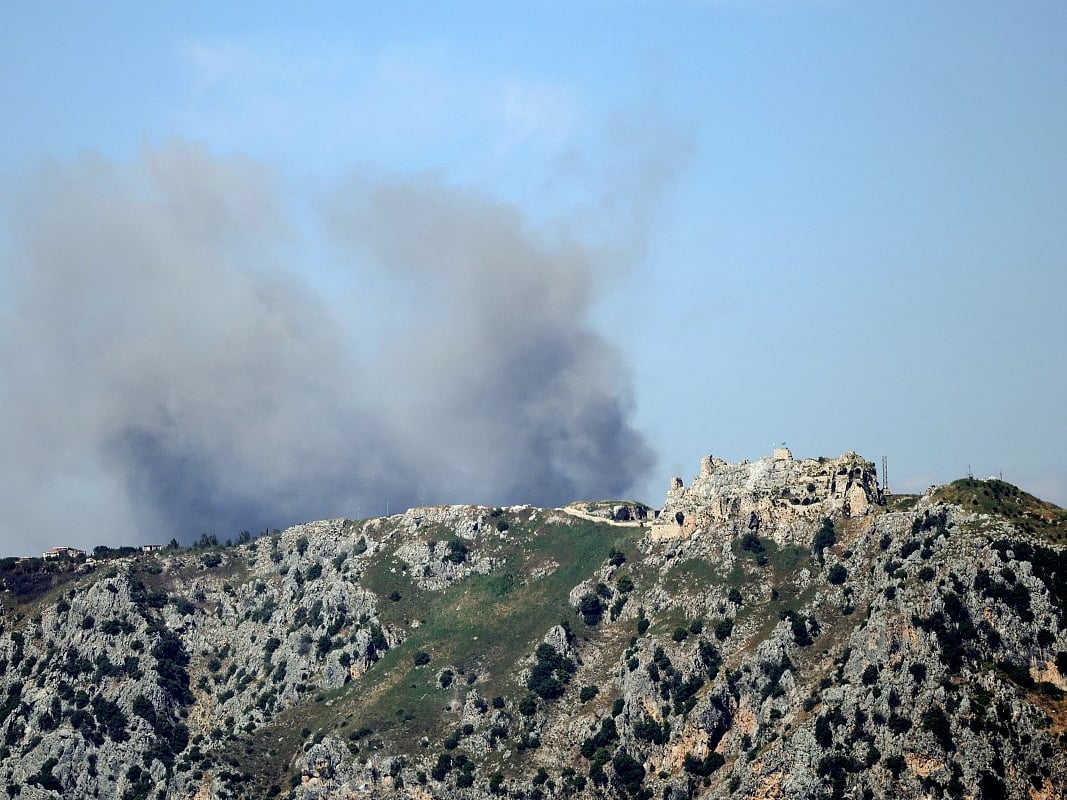 This picture taken from a position in the Marjayoun area of southern Lebanon shows smoke rising in the distance, behind the medieval Beaufort Castle, known locally as Qalaat al-Shaqif or Shaqif Arnoun, following an Israeli airstrike on the village of Yohmor on May 31, 2026.