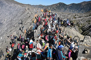 Hindu devotees of the Tengger community ascend the active Mount Bromo volcano to present offerings of rice, fruit, livestock and other items as part of the Yadnya Kasada festival near Probolinggo, East Java province on June 1, 2026.