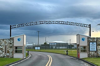 FILE - Clouds hover over the entrance of the Florida State Prison in Starke, Fla., Aug. 3, 2023. (AP Photo/Curt Anderson, File)