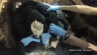 This screen grab from bodycam video taken on December 3, 2025 and released by Hampshire & Isle of Wight Constabulary to AFP on June 2, 2026 shows 18-year-old student Henry Nowak being handcuffed by police before his death, following a false claim of racial abuse, in Southampton, south England.