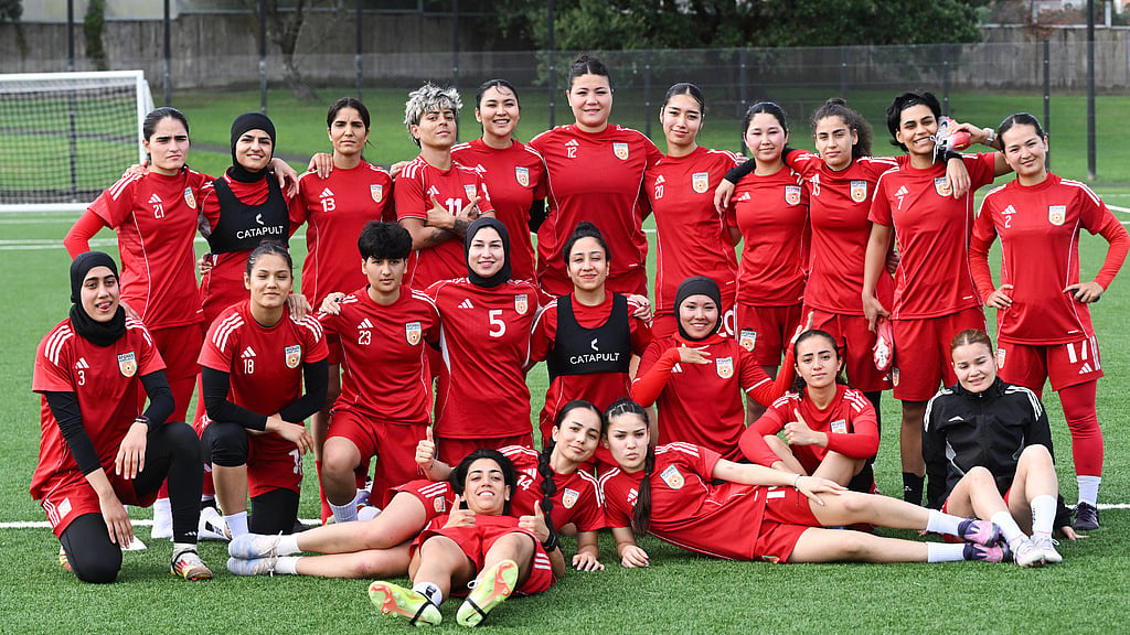 Afghan women's players pose for a team photo during a training session in Auckland, New Zealand, Tuesday, June 2, 2026. (Andrew Cornaga/Photosport via AP)