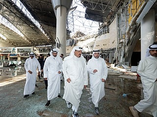 This handout photo provided by the Kuwaiti News Agency (KUNA) on June 3, 2026 shows Kuwaiti Prime Minister Sheikh Ahmad al-Abdullah al-Sabah (C) inspecting the damaged airport after an Iranian attack, in Kuwait City.