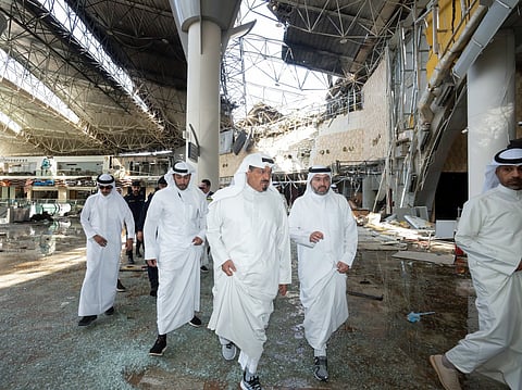 This handout photo provided by the Kuwaiti News Agency (KUNA) on June 3, 2026 shows Kuwaiti Prime Minister Sheikh Ahmad al-Abdullah al-Sabah (C) inspecting the damaged airport after an Iranian attack, in Kuwait City.