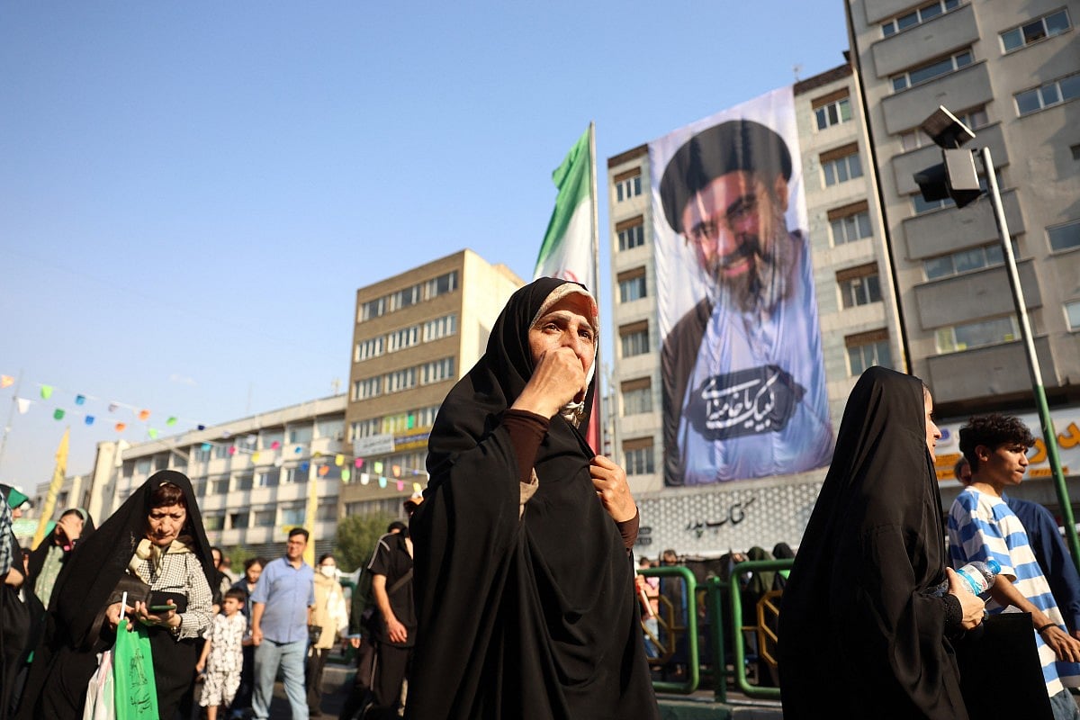 Iranians take part during a rally in support of the country's supreme leader Mojtaba Khamenei and commemorate Eid al-Ghadir in Tehran on June 4, 2026.