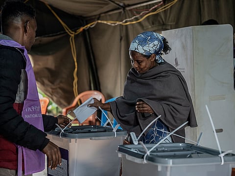 An Ethiopian woman casts her vote at a polling station in the general election in Addis Ababa, Ethiopia, Monday, June 1, 2026.