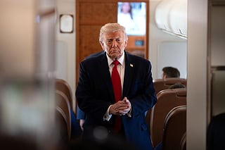 President Donald Trump arrives to speak to reporters aboard Air Force One en route from Joint Base Andrews, Md., to Eau Claire, Wis., Friday, June 5, 2026. (AP Photo/Mark Schiefelbein)