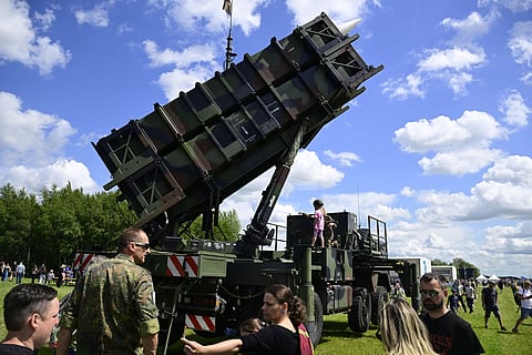 Visitors queue to take a closer look at a Patriot missile launcher during the Armed Forces Day at the Airbase in Laage, Germany, on June 06, 2026.