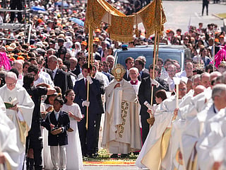 Pope Leo XIV walks along Alcala Street during the Corpus Christi procession following the Holy Mass held in the Plaza de Cibeles in Madrid.