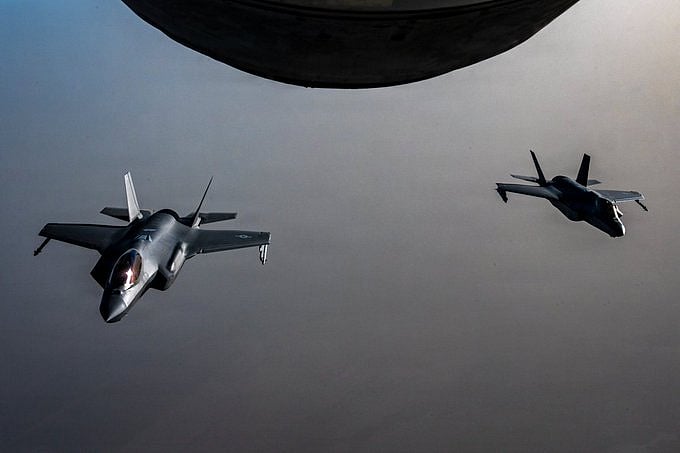 Two US Air Force F-35A stealth fighter jets fly over the Middle East during a patrol.
