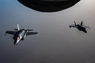 Two US Air Force F-35A stealth fighter jets fly over the Middle East during a patrol.