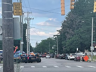 Police officers work at the scene of a shooting near a festival in Toledo, Ohio.