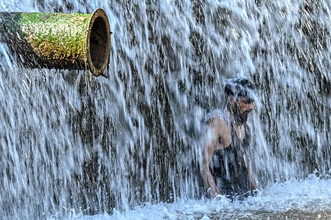 A man cools off in a stream on the outskirts of Islamabad as a heatwave sweeps across Pakistan on June 8, 2026. The Pakistan Meteorological Department forecast hot and dry conditions nationwide, with temperatures reaching 46°C in Sindh province. Residents sought relief in waterways as scorching summer temperatures intensified.