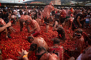 People throw tomatoes during the 16th Tomato Fight Festival known as "Tomatina" in Sutamarchan, Boyaca department, Colombia.
