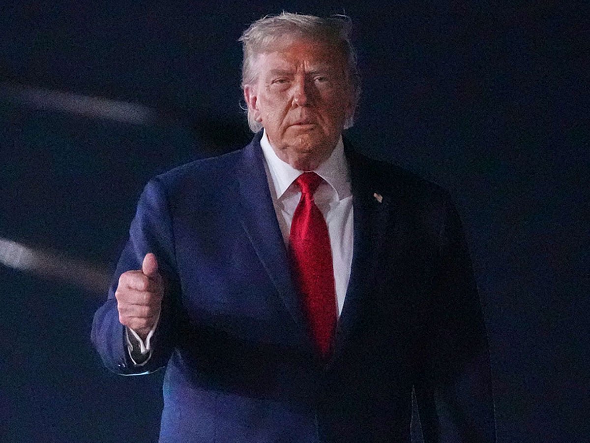 President Donald Trump walks over to talk with reporters before boarding Air Force One at John F. Kennedy International Airport in New York, early Tuesday, June 9, 2026.