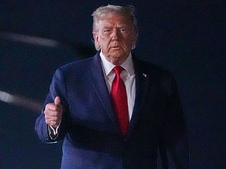 President Donald Trump walks over to talk with reporters before boarding Air Force One at John F. Kennedy International Airport in New York, early Tuesday, June 9, 2026. (AP Photo/Mark Schiefelbein)