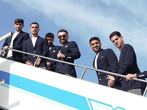 Iran's national team players (From L) defender Mehdi Torabi, left winger Mehdi Ghayedi, midfielder Amirmohammad Razzaghinia, left winger Mohammad Mohebi and goalkeeper Payam Niazmand boarding a plane at Antalya Airport ahead of their departure to Mexico for the FIFA 2026 World Cup football tournament, in Antalya, Turkey.