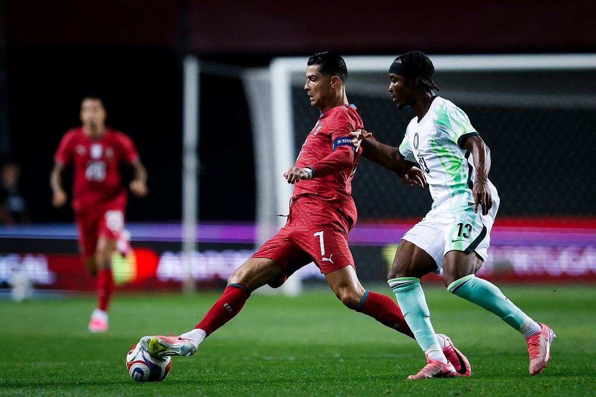 Portugal's forward #07 Cristiano Ronaldo fights for the ball with Nigeria's defender #13 Bruno Onyemaechi during the international friendly football match between Portugal and Nigeria at Magalhaes Pessoa Stadium in Leiria, on June 10, 2026.