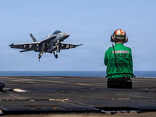 This US Navy handout photo released on May 26, 2026, by US Central Command Public Affairs shows an F/A-18E Super Hornet, attached to Strike Fighter Squadron (VFA) 14, preparing to make an arrested landing on the flight deck of Nimitz-class aircraft carrier USS Abraham Lincoln on May 25, 2026. Iran's chief negotiator said on May 31, that Tehran will not agree to any deal with the United States that fails to secure the rights of Iranians. His remarks came as Iran and Washington continue to exchange proposals over a framework for a deal to end the war that broke out on February 28, engulfing the Middle East. (Photo by various sources / AFP) / RESTRICTED TO EDITORIAL USE - MANDATORY CREDIT "AFP PHOTO / US NAVY / NAVCENT PUBLIC AFFAIRS" - HANDOUT - NO MARKETING NO ADVERTISING CAMPAIGNS - DISTRIBUTED AS A SERVICE TO CLIENTS