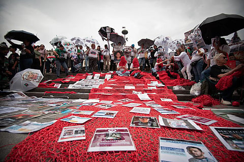 Relatives of missing persons and members of search collectives protest during the opening of the FIFA World Cup 2026 in downtown Guadalajara, Jalisco state, Mexico, on June 11, 2026.