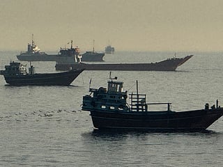 Vessels are seen anchored in the Strait of Hormuz, off the port city of Khasab on Oman’s northern Musandam Peninsula on May 17, 2026. Washington, locked in conflict with Tehran since US and Israeli forces launched major strikes on the Islamic republic beginning February 28, has struggled to break an impasse and make any progress toward ending a war that has shaken the Middle East and sent energy prices climbing. The war has led to an effective blockade of the critical Strait of Hormuz, through which some 20 percent of global oil exports pass in peacetime, and has drawn neighbors Israel and Lebanon into a deadly side conflict. (Photo by AFP) /