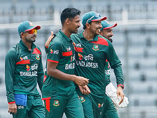 Bangladesh's Mustafizur Rahman, center, celebrates with teammates the wicket of Australia's Alex Carey during the second ODI match against Australia  in Mirpur, Bangladesh, on Thursday, June 11, 2026. 