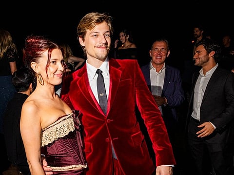 Millie Bobby Brown and Jake Bongiovi attend Netflix's "Stranger Things" Season 5 World Premiere at TCL Chinese 6 Theatres on November 06, 2025 in Hollywood, California.