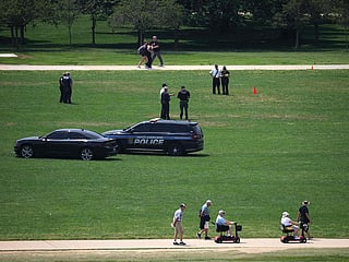 Members of law enforcement respond to the National Mall as the numbers “8647” are seen in the grass on June 11, 2026 in Washington, DC. The numbers have been adopted by critics of President Donald Trump's administration, serving as a form of protest.  