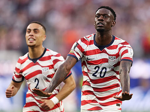 Folarin Balogun #20 of the United States celebrates scoring his team's third goal during the FIFA World Cup 2026 Group D match against Paraguay at Los Angeles Stadium on June 12, 2026 in Los Angeles, California.   