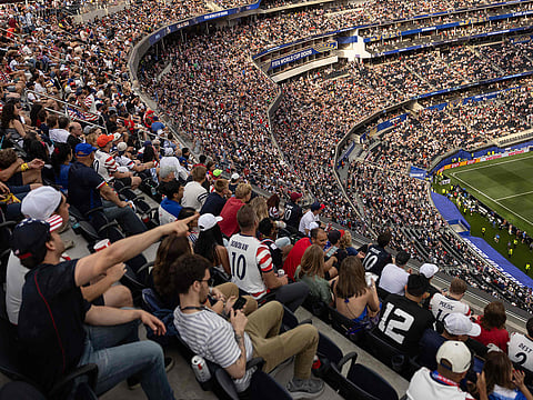 Fans watch the 2026 World Cup Group D football match between USA and Paraguay at the Los Angeles Stadium in Inglewood, California, on June 12, 2026.