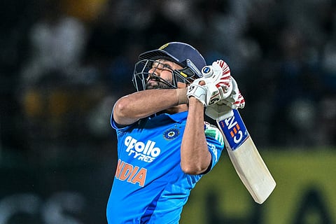 India's Rohit Sharma watches the ball after playing a shot during the first one-day international (ODI) cricket match between India and Afghanistan at the Himachal Pradesh Cricket Association Stadium in Dharamsala on June 13, 2026.