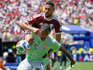 Qatar's Mohamed Manai attempts to get the ball as Switzerland's Manuel Akanji defends during the World Cup Group B soccer match in Santa Clara, California, on Saturday, June 13, 2026. 