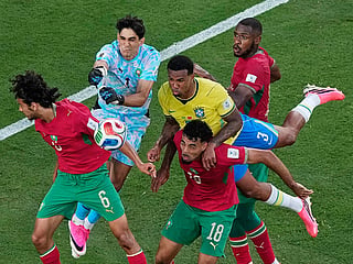 Morocco goalkeeper Yassine Bounou punches the ball away from Brazil's Gabriel Magalhaes as Morocco's Ayyoub Bouaddi, Chadi Riad and Issa Diop get in on the play during the World Cup Group C soccer match in East Rutherford, N.J., near New York, Saturday, June 13, 2026. 