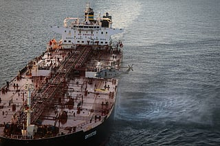 In this photo provided by the Royal Navy, Royal Marine Commandos detain sanctioned tanker, the Smyrtos, in the English Channel, Sunday, June 14, 2026. (LPhot Hutchins/Royal Navy via AP)