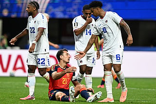 Spain's forward #21 Mikel Oyarzabal (2ndL) is comforted by Cape Verde's midfielder #06 Kevin Pina (R) at the end of the 2026 World Cup Group H football match between Spain and Cape Verde at the Atlanta Stadium in Atlanta on June 15, 2026.