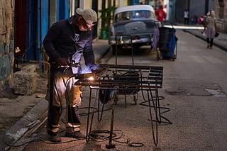 A man welds a door in Havana, Cuba, Tuesday, June 9, 2026.