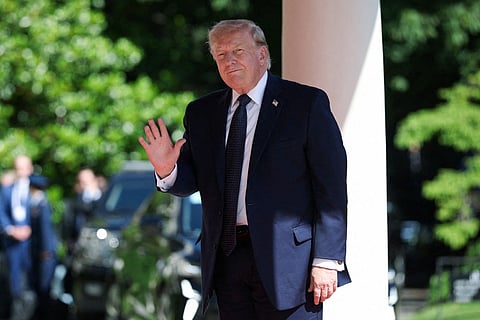 US President Donald Trump waves as he arrives for the G7 summit, in Evian, eastern France, on June 15, 2026.