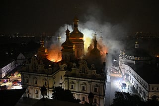 Smoke and fire rises from the Dormition Cathedral in the Orthodox complex of the Kyiv Pechersk Lavra following a missile strike on the Ukrainian capital Kyiv on June 15, 2026.