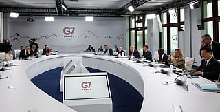 Japan's Prime Minister Sanae Takaichi (L), Britain's Prime Minister Keir Starmer (2nd L), European Council President Antonio Costa (4th L) and (From L, right side) Germany’s Chancellor Friedrich Merz, India's Prime Minister Narendra Modi, US President Donald Trump, France's President Emmanuel Macron, Kenya's President William Ruto, Italy's Prime Minister Giorgia Meloni and South Korea's President Lee Jae Myung attend a working session with G7 leaders and outreach partners on international investment partnerships, during the G7 summit, in Evian, eastern France, on June 16, 2026.