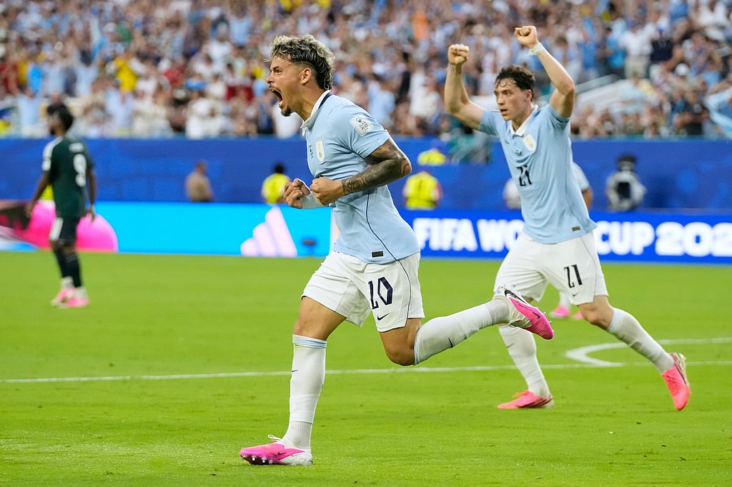 Uruguay's Maxi Araujo celebrates scoring his side's opening goal against Saudi Arabia during a World Cup Group H soccer match in Miami Gardens, Fla., Monday, June 15, 2026. (AP Photo/Lynne Sladky)