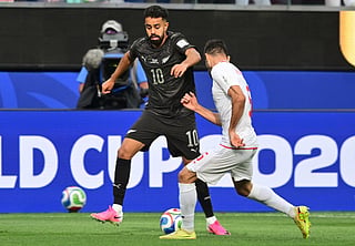 New Zealand's forward #10 Sarpreet Singh and Iran's defender #05 Milad Mohammadi fight for the ball during the 2026 World Cup Group G football match between Iran and New Zealand at Los Angeles Stadium in Inglewood on June 15, 2026.