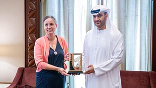 Mahmood Khaleel Alhashmi, Director General of the Department of Tourism, Culture and Media in Ajman, presenting a shield to Sybille Pfaff, Consul General of Germany in Dubai and the Northern Emirates during their meeting in Ajman