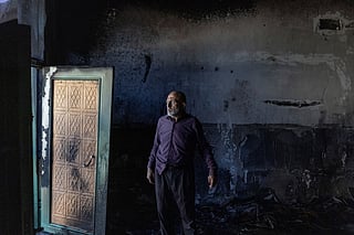 A Palestinian man inspects the damage inside a mosque reportedly burnt by Israeli settlers over night, in the Israeli occupied West Bank village of Jiljlia, just north of the West Bank city of Ramallah on June 17, 2026.