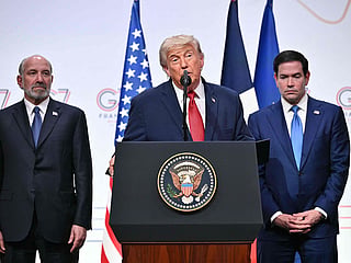 US President Donald Trump (C) addresses the media alongside US Secretary of State Marco Rubio (R) and US Commerce secretary Howard Lutnick (L) during a closing press conference at the G7 summit.