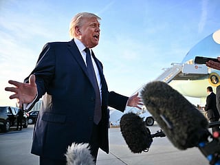 US President Donald Trump addresses the media on the tarmac after arriving at Paris Orly Airport enroute to a dinner to celebrate the 250th anniversary of the independence of the United States, at Orly Airport, south of Paris, on June 17, 2026. (Photo by Mandel NGAN / AFP)