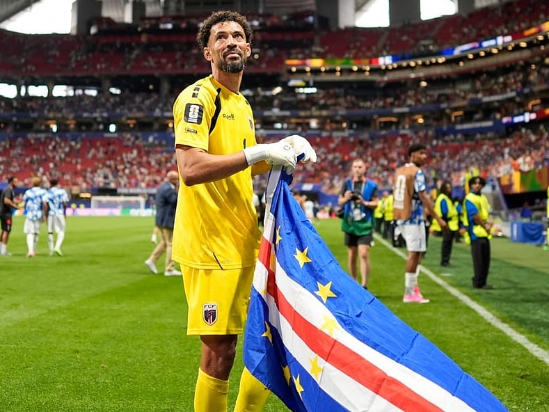 Cape Verde goalkeeper Vozinha celebrates as holds the flag of his country after the World Cup Group H soccer match between Spain and Cape Verde in Atlanta, Monday, June 15, 2026.