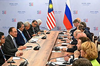 Russian President Vladimir Putin, fourth right, and Malaysian Prime Minister Anwar Ibrahim, second left, attend a talks on the sidelines of the Russia-ASEAN summit in Kazan, Russia, Wednesday, June 17, 2026. (Sergei Bobylev/Sputnik, Kremlin Pool Photo via AP)