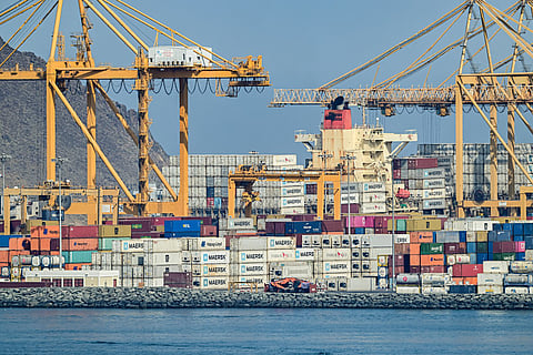 Containers are stacked along a pier at the Khor Fakkan Container Terminal, the only natural deep-sea port in the region and one of the major container ports in Sharjah Emirate, along the Gulf of Oman.